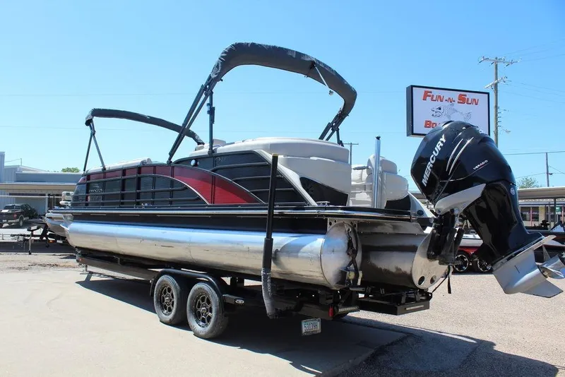 Slide: The Image of 2019 Bennington 25 QSR pontoon boat with Mercury outboard motor on trailer. - 7