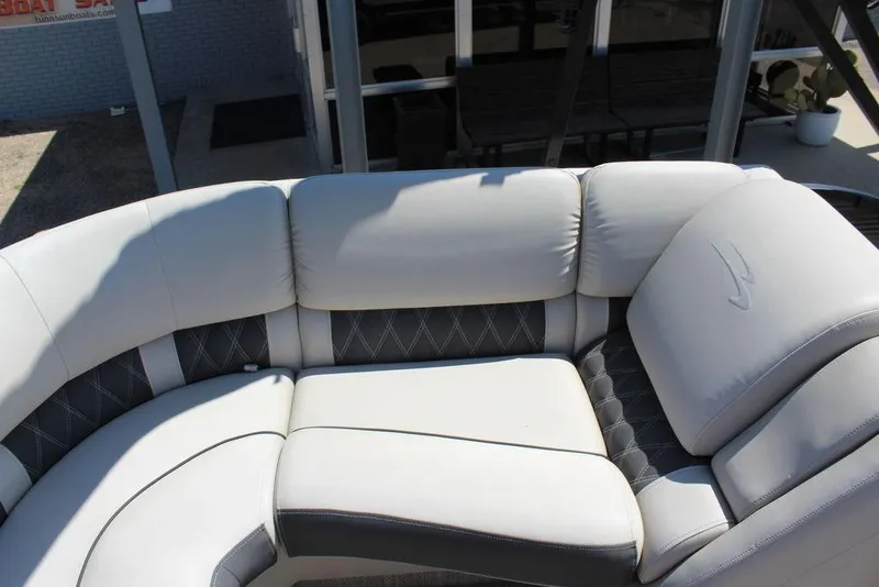 Slide: The Image of Luxurious seating on a 2019 Bennington 25 QSR pontoon boat, featuring elegant upholstery. - 8