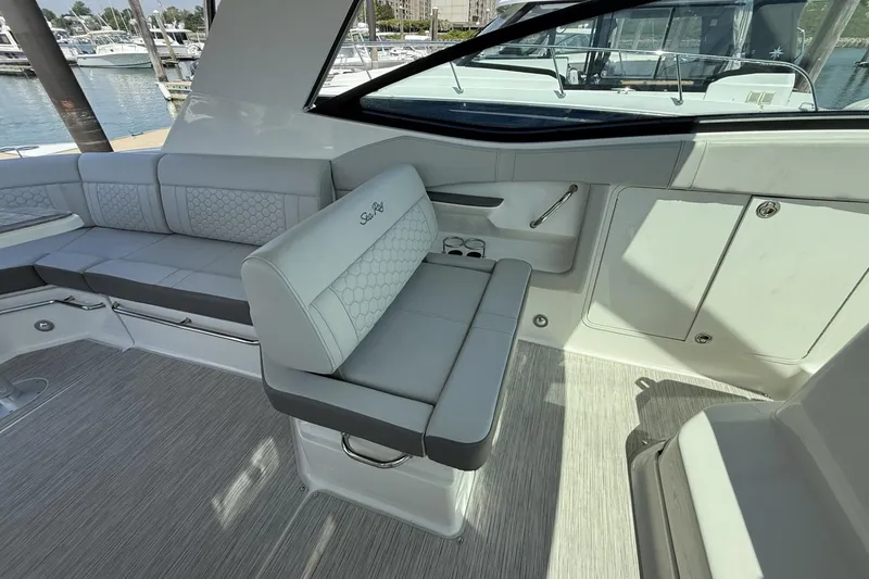 Slide: The Image of 2023 Sea Ray Sundancer 320 interior with elegant seating and modern design. - 18