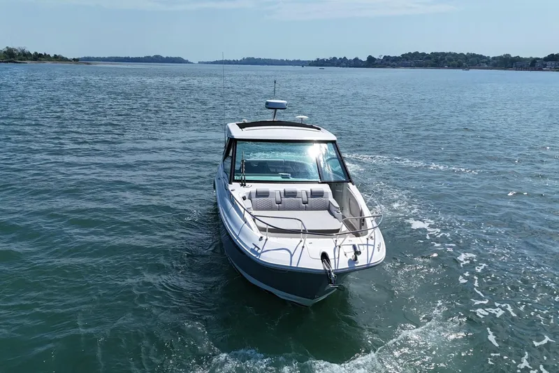 Slide: The Image of 2023 Sea Ray Sundancer 320 cruising on open water under clear skies. - 3