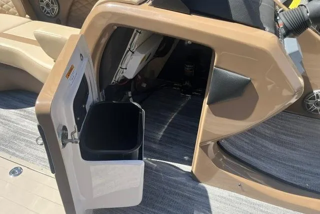 Slide: The Image of Interior of 2026 Godfrey Monaco 235 SB boat with open storage compartment. - 15
