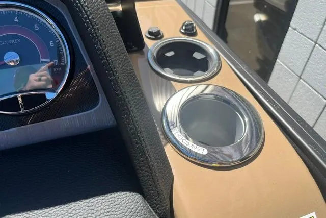 Slide: The Image of Dashboard of 2026 Godfrey Monaco 235 SB with cup holders and instrument panel. - 19