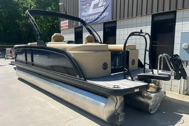 Slide: The Image of 2026 Godfrey Monaco 235 SB pontoon boat with sleek design and comfortable seating. - 4