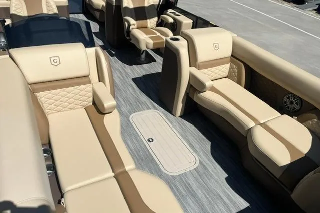 Slide: The Image of Luxurious interior of 2026 Godfrey Monaco 235 SB pontoon boat with beige seating. - 7