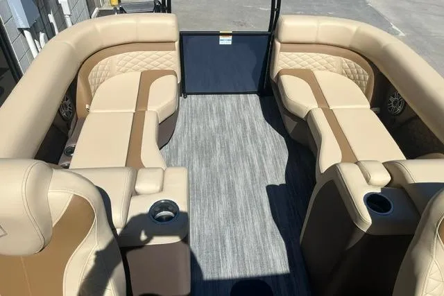 Slide: The Image of Luxurious interior of 2026 Godfrey Monaco 235 SB pontoon boat with beige seating. - 9