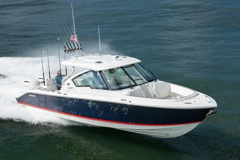 The Image of Manufacturer Provided Image: 2026 Pursuit DC 326 Dual Console boat cruising on open water. - 0