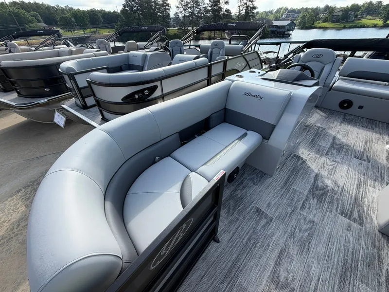 Slide: The Image of 2026 Bentley Pontoons Legacy 223 Swingback on a lake. - 10