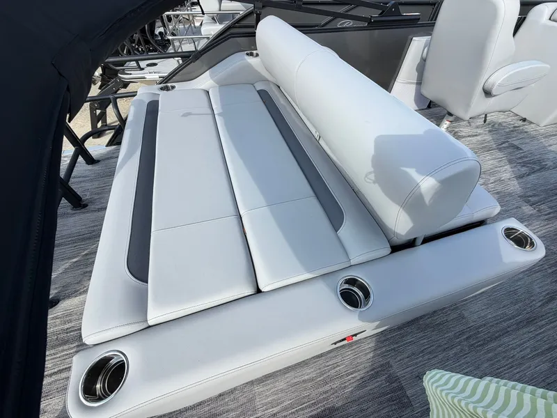 Slide: The Image of 2026 Bentley Pontoons Legacy 223 Swingback seating area with cup holders. - 2
