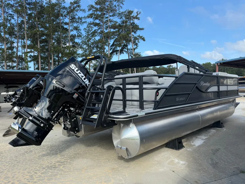 Slide: The Image of 2026 Bentley Pontoons Legacy 223 with Suzuki engine, parked outdoors. - 4