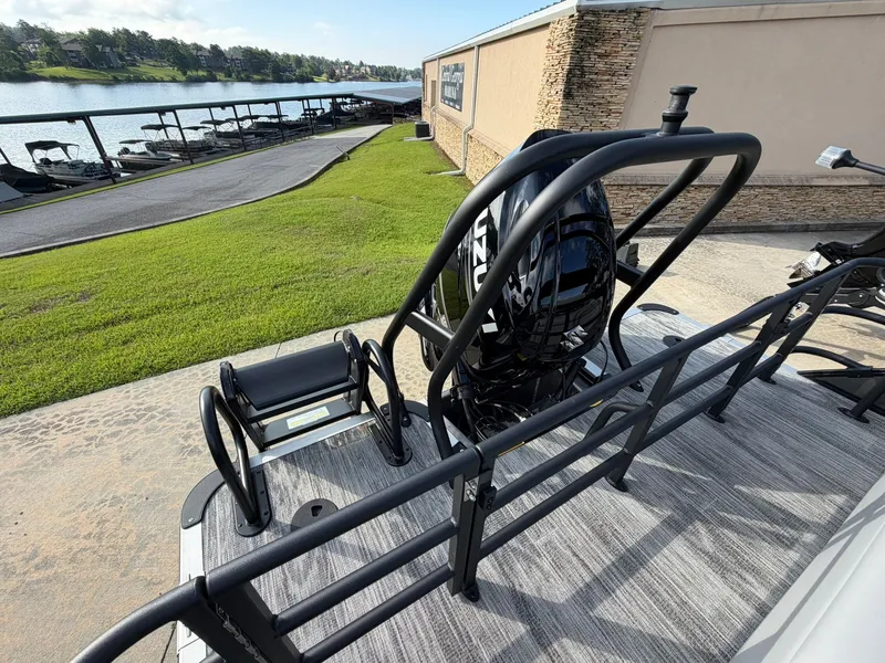 Slide: The Image of Bentley Pontoons Legacy 223 Swingback 2026 parked by the lakeside. - 8
