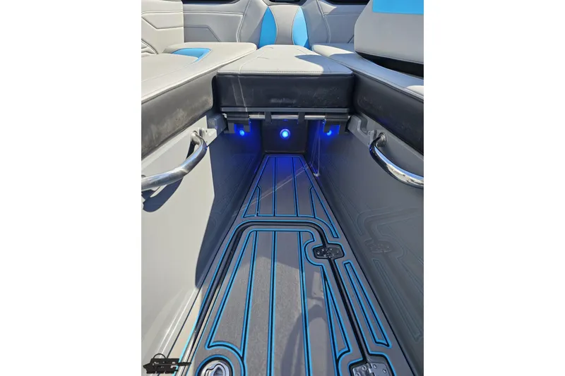 Slide: The Image of Interior of 2025 Sunsation 32 CCX boat with sleek seating and illuminated flooring. - 100