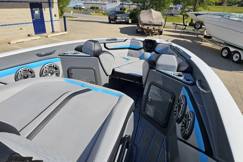 Slide: The Image of 2025 Sunsation 32 CCX boat interior with modern seating and audio system. - 101
