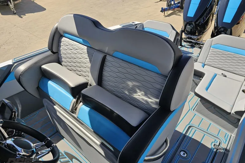 Slide: The Image of 2025 Sunsation 32 CCX boat interior with stylish blue and gray seating. - 105