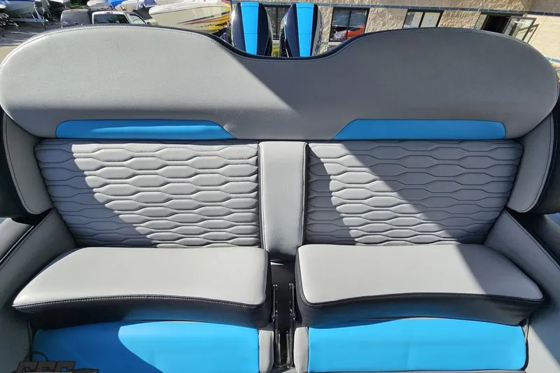 Slide: The Image of 2025 Sunsation 32 CCX boat interior with gray and blue cushioned seating. - 107