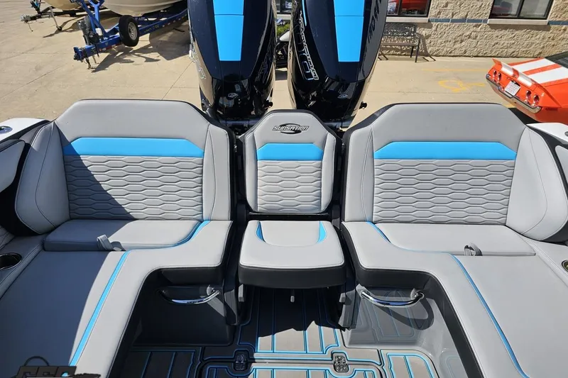 Slide: The Image of 2025 Sunsation 32 CCX boat interior with gray and blue seating, showcasing modern design. - 109