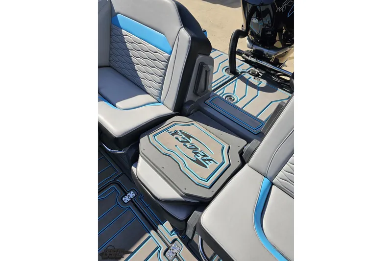 Slide: The Image of 2025 Sunsation 32 CCX boat interior with stylish gray and blue seating and flooring design. - 112