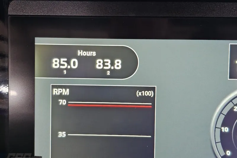 Slide: The Image of Display panel of 2025 Sunsation 32 CCX showing engine hours and RPM. - 114