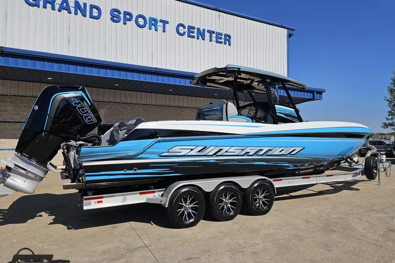 Slide: The Image of 2025 Sunsation 32 CCX boat with powerful outboard engine at Grand Sport Center. - 12