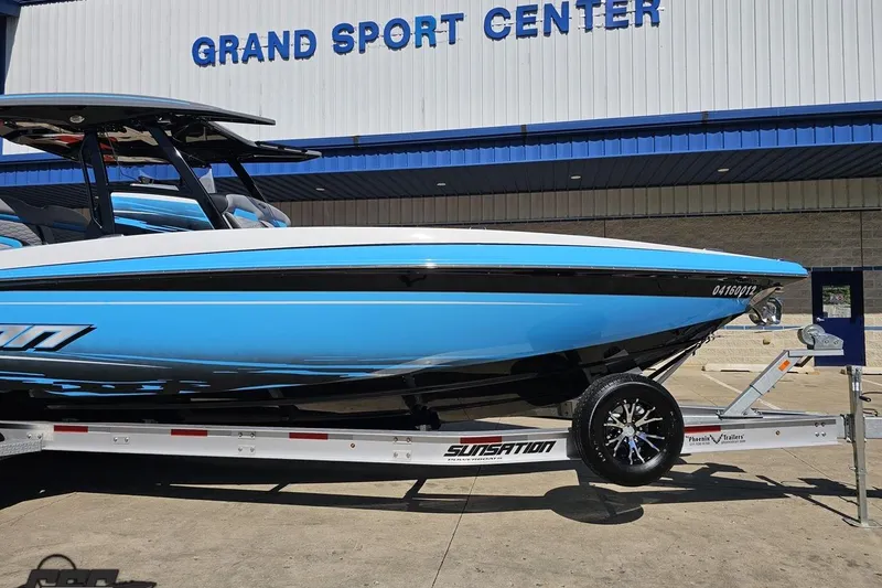 Slide: The Image of 2025 Sunsation 32 CCX boat on trailer at Grand Sport Center. - 14