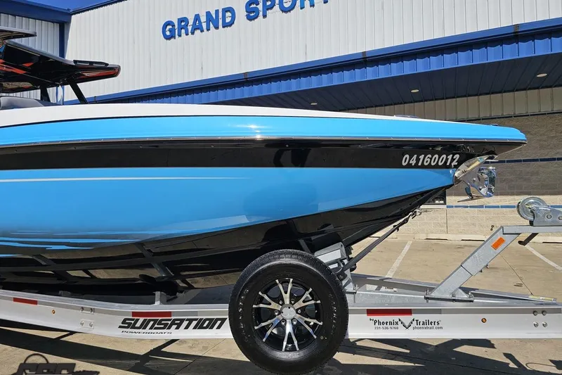 Slide: The Image of 2025 Sunsation 32 CCX boat on trailer at Grand Sport Center. - 16