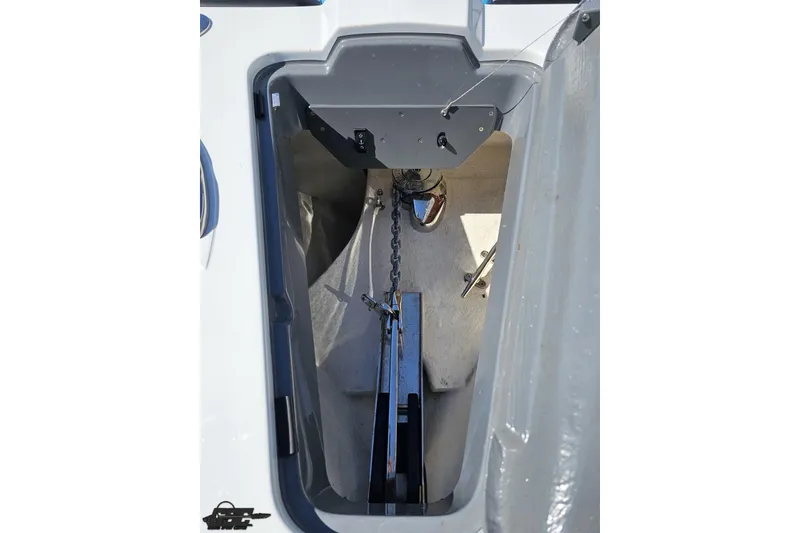 Slide: The Image of Anchor compartment of 2025 Sunsation 32 CCX boat, featuring chain and anchor mechanism. - 19