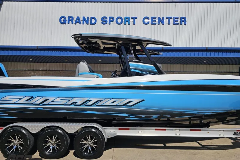 Slide: The Image of 2025 Sunsation 32 CCX boat in blue at Grand Sport Center. - 3