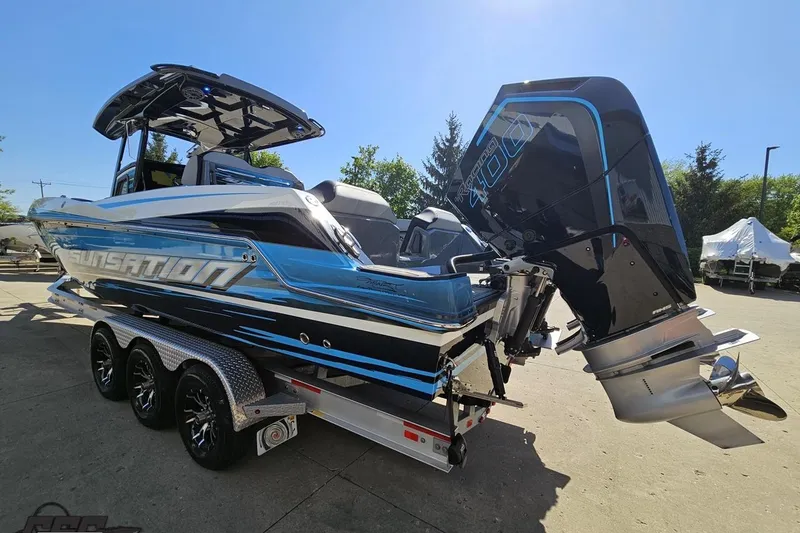 Slide: The Image of 2025 Sunsation 32 CCX boat with powerful outboard engine on a trailer. - 31