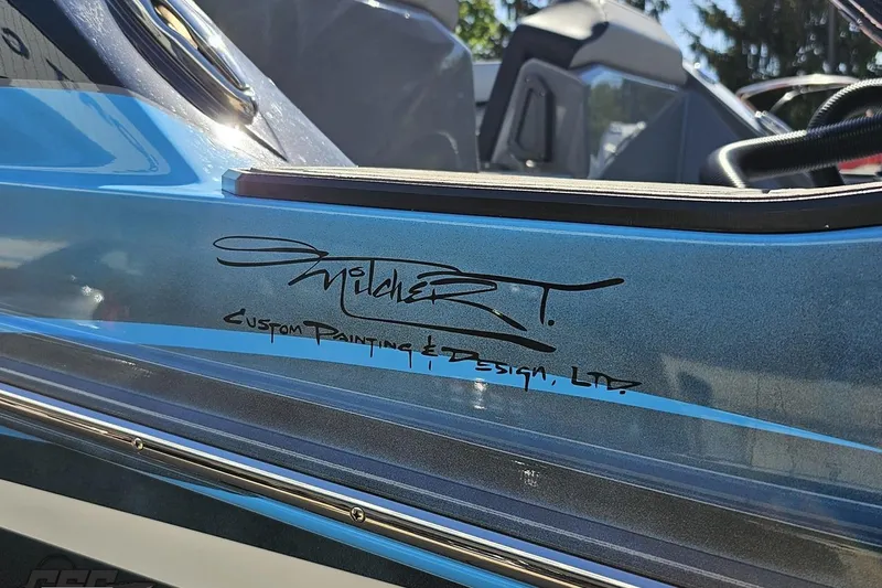 Slide: The Image of 2025 Sunsation 32 CCX boat with custom paint design by Mitcher T. - 32