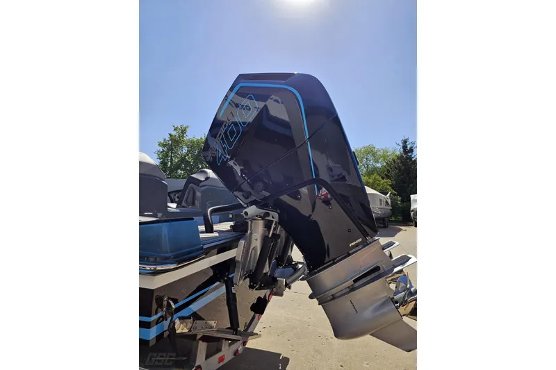Slide: The Image of 2025 Sunsation 32 CCX boat with powerful outboard motor under clear sky. - 34