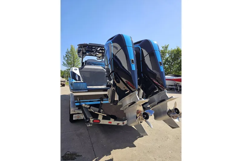 Slide: The Image of 2025 Sunsation 32 CCX boat with dual outboard engines on a trailer. - 35