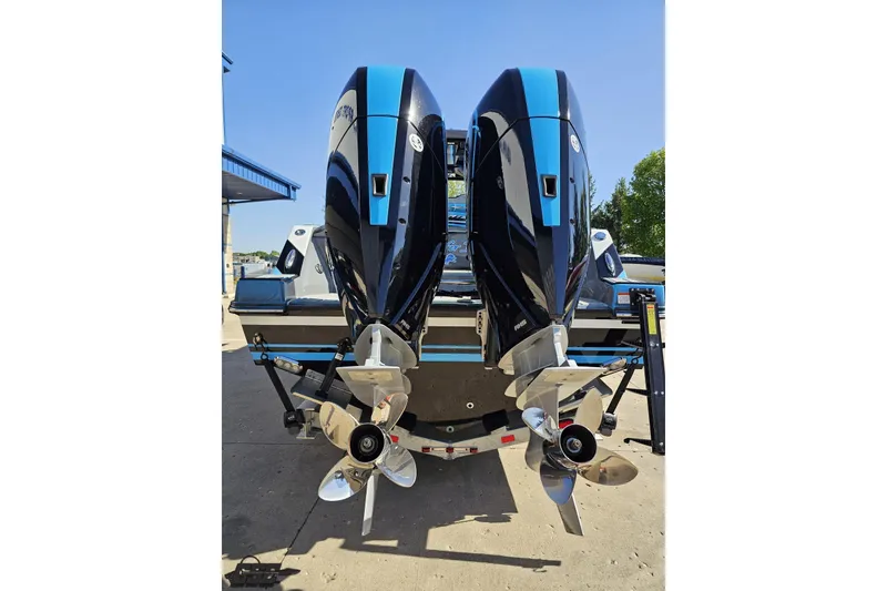 Slide: The Image of 2025 Sunsation 32 CCX boat with dual outboard engines, rear view. - 37