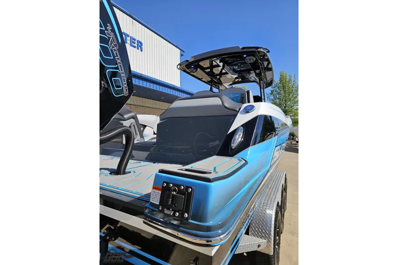Slide: The Image of 2025 Sunsation 32 CCX boat with sleek blue design and modern features. - 40