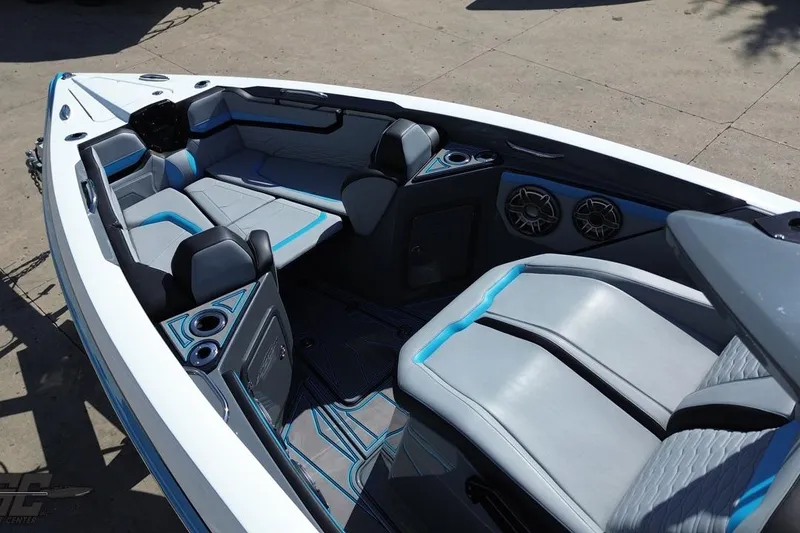 Slide: The Image of 2025 Sunsation 32 CCX boat interior with modern seating, cup holders, and speakers. - 51