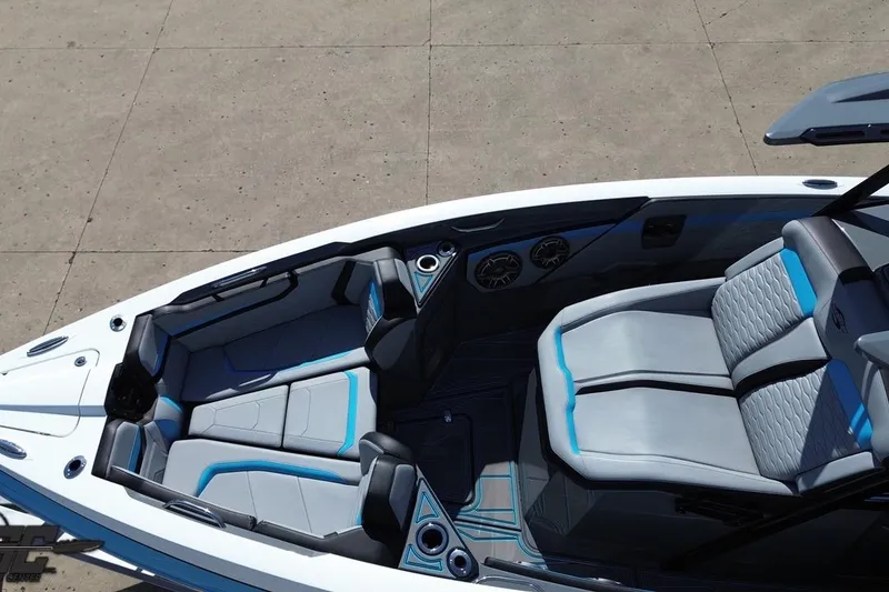 Slide: The Image of 2025 Sunsation 32 CCX boat interior with sleek gray and blue seating design. - 52