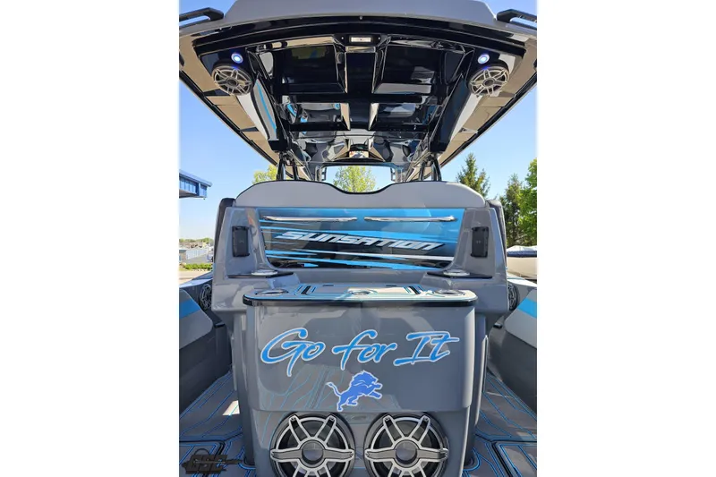 Slide: The Image of 2025 Sunsation 32 CCX boat with sleek design, custom graphics, and advanced audio system. - 57