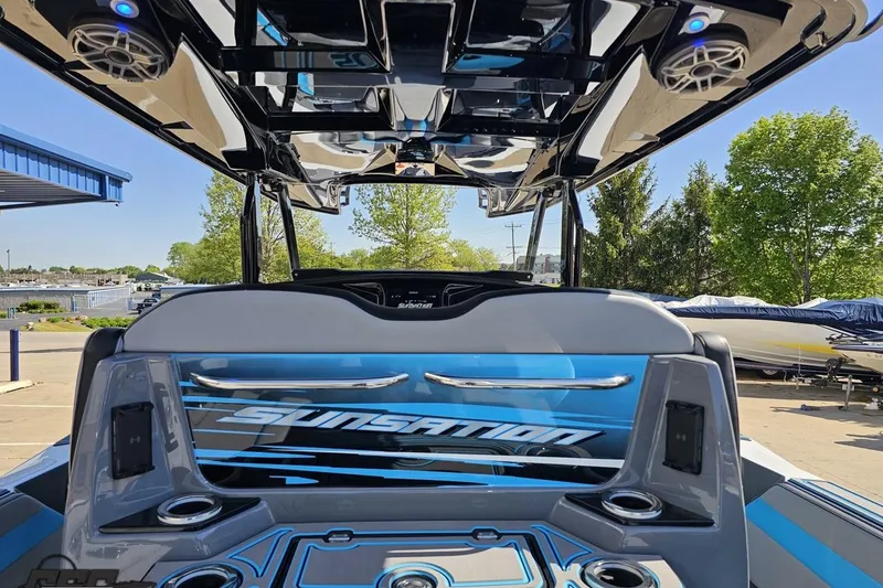 Slide: The Image of 2025 Sunsation 32 CCX boat interior with sleek design and modern audio system. - 58