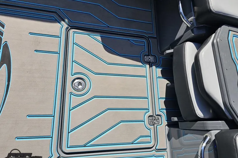 Slide: The Image of 2025 Sunsation 32 CCX boat deck with sleek blue-lined design and seating. - 65