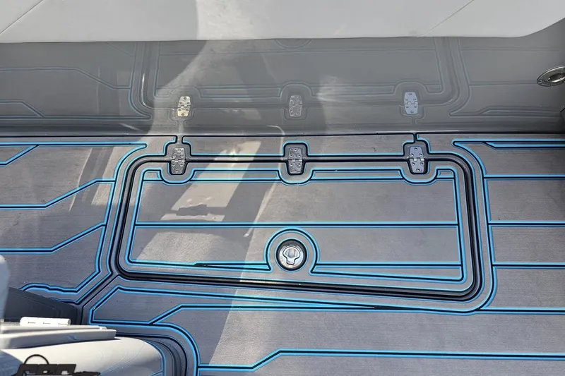 Slide: The Image of 2025 Sunsation 32 CCX boat deck with sleek blue-lined design. - 66