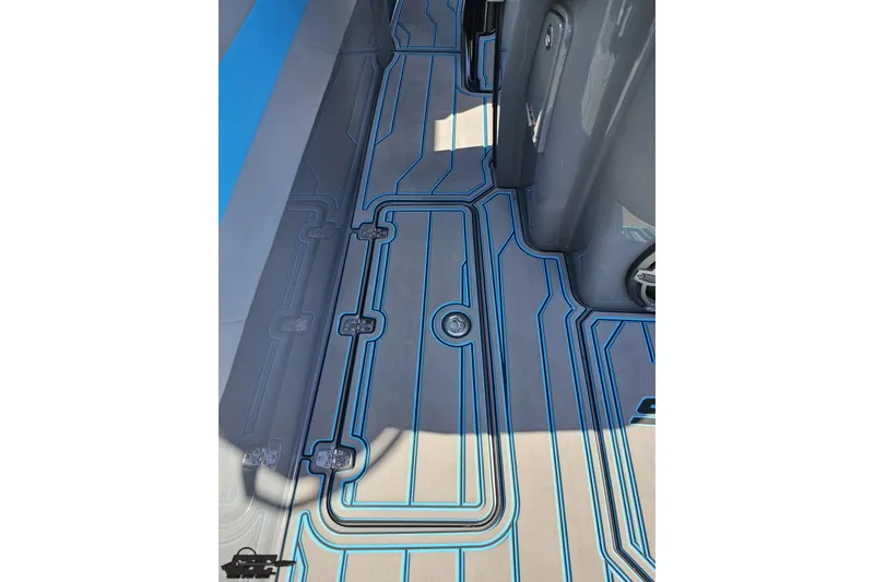 Slide: The Image of 2025 Sunsation 32 CCX boat deck with modern blue and gray design. - 67