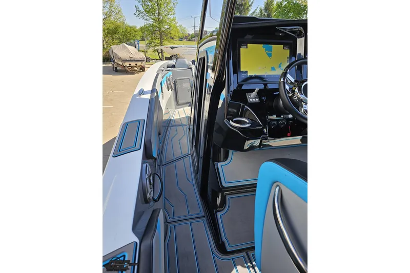 Slide: The Image of 2025 Sunsation 32 CCX boat interior with modern navigation system and sleek design. - 68