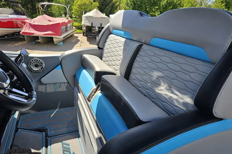 Slide: The Image of 2025 Sunsation 32 CCX boat interior with stylish blue and gray seating, showcasing modern design. - 70