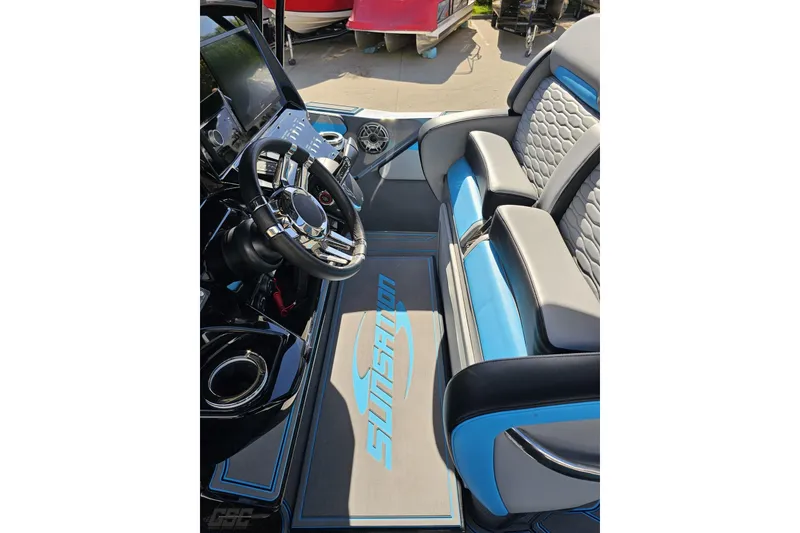 Slide: The Image of 2025 Sunsation 32 CCX boat interior with modern steering and seating design. - 76