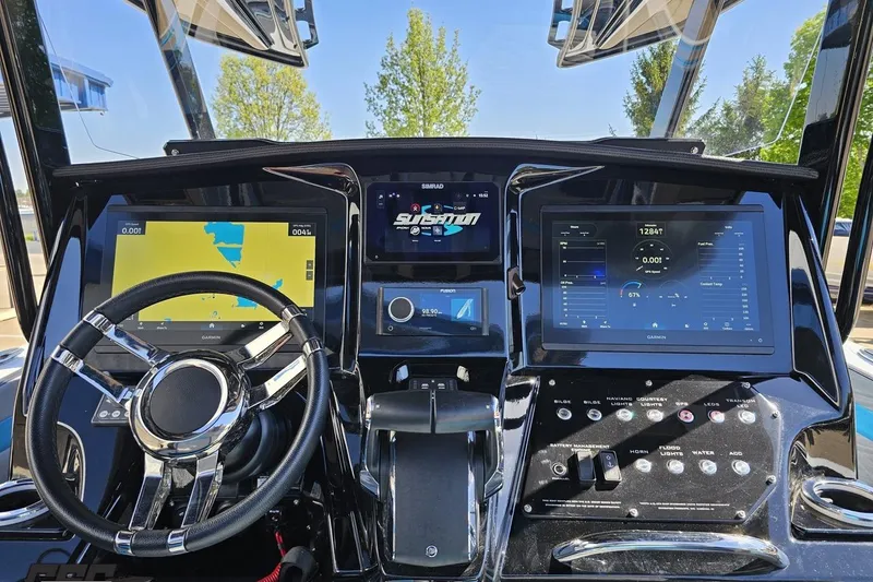 Slide: The Image of Dashboard of 2025 Sunsation 32 CCX boat with advanced navigation displays. - 80