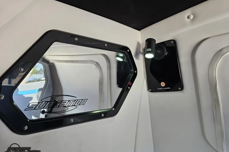 Slide: The Image of Interior view of 2025 Sunsation 32 CCX cabin with window and cabin lights. - 90