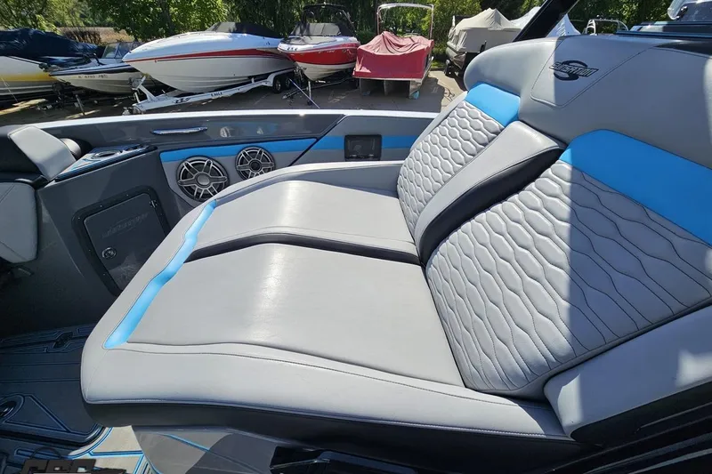 Slide: The Image of Luxurious interior of 2025 Sunsation 32 CCX boat with stylish seating and speakers. - 92