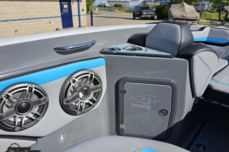 Slide: The Image of 2025 Sunsation 32 CCX boat interior with speakers and seating, showcasing modern design. - 96