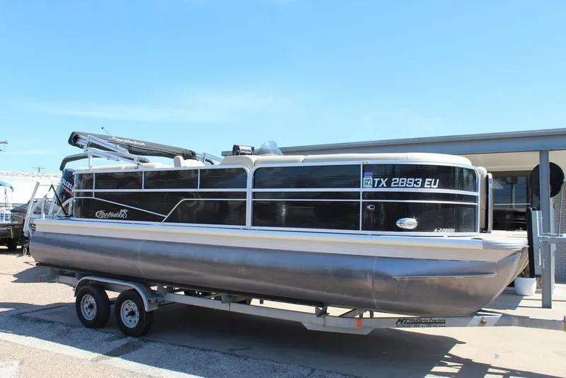 Slide: The Image of 2019 Misty Harbor 2285 Adventure Fishing pontoon boat on trailer, side view. - 5