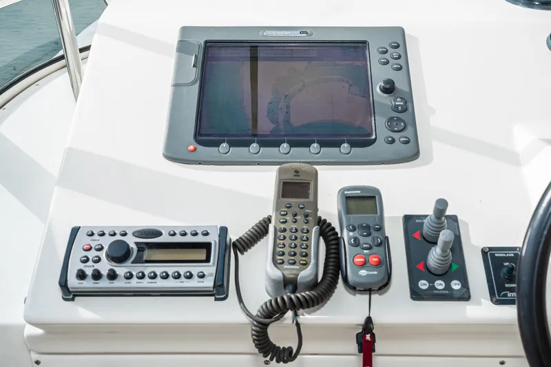 Slide: The Image of Control panel of a 2006 Navigator 5100 yacht with navigation and communication devices. - 11