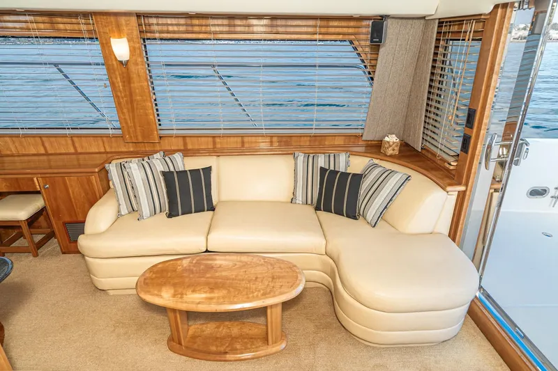 Slide: The Image of Luxurious interior of 2006 Navigator 5100 yacht with cream sofa and striped cushions. - 20