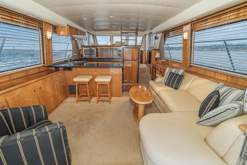 Slide: The Image of Luxurious interior of 2006 Navigator 5100 yacht with elegant seating and ocean view. - 21